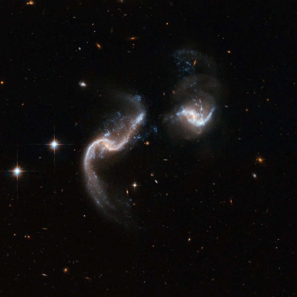 Two galaxies in the shape of a question mark