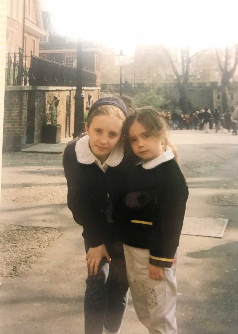 two young sisters pose for a family photo in london