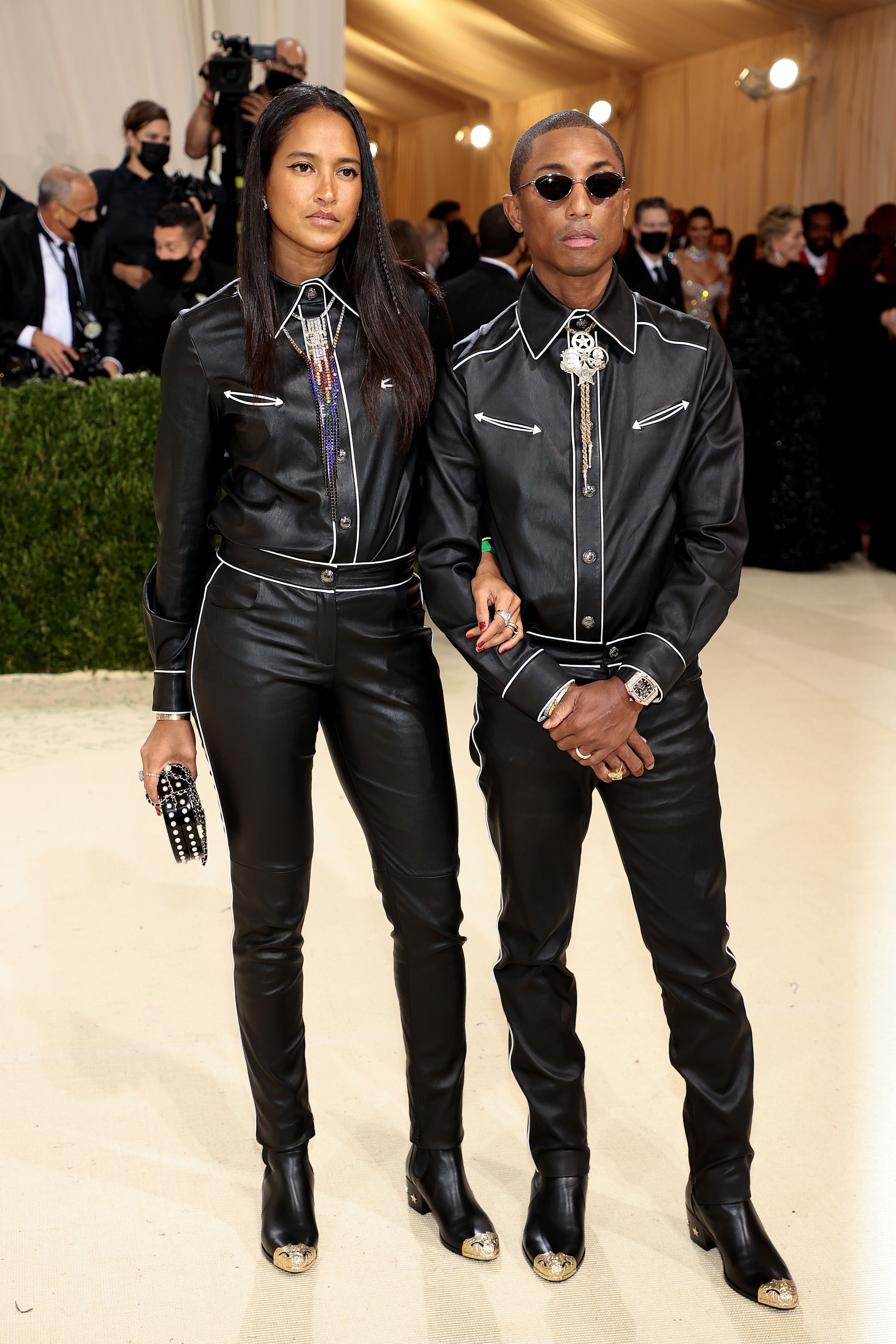 Pharrell Williams, right, and wife Helen Williams attend the