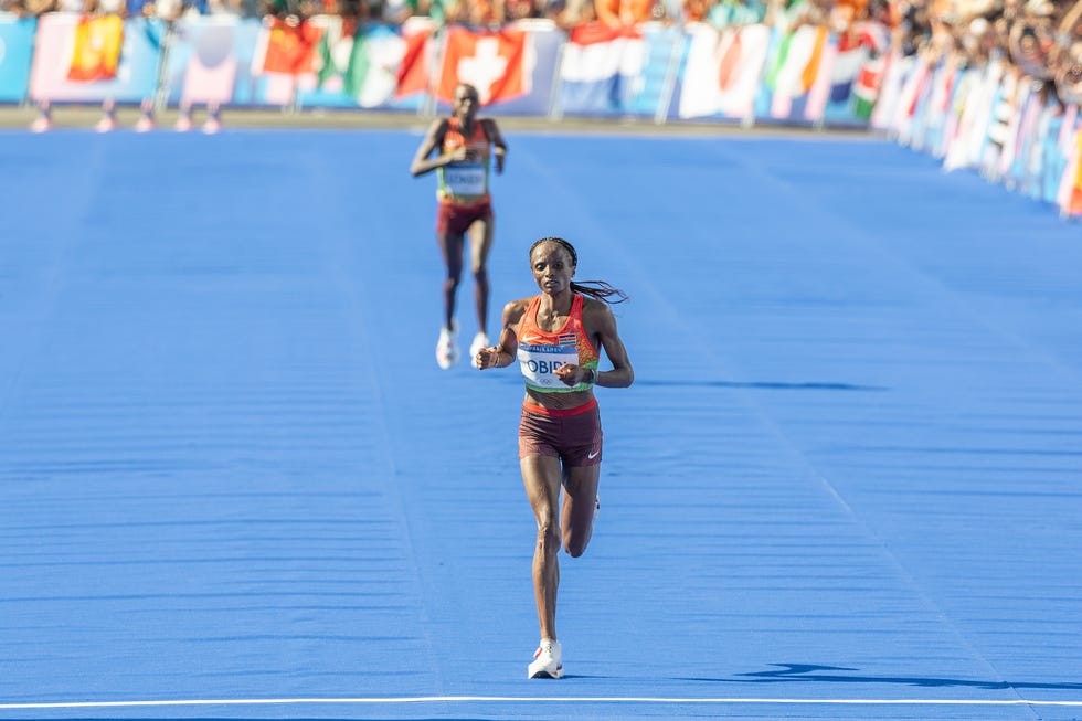 Paris, France, August 11. Kenya's Hellen Obiri crosses the finish line to win the bronze medal in the women's marathon on day 16 of the Paris 2024 Olympic Games at the Esplanade des Invalides on August 11, 2024 in Paris, France. Photo by Steve Christo Corbiscorbis via Getty Images