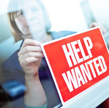 help wanted sign on retail display window for employment job available