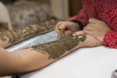 henna being applied at a henna party