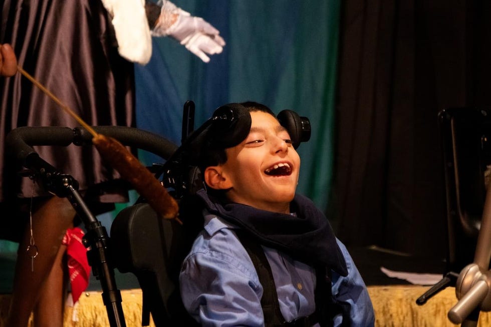 henry in his wheelchair on stage