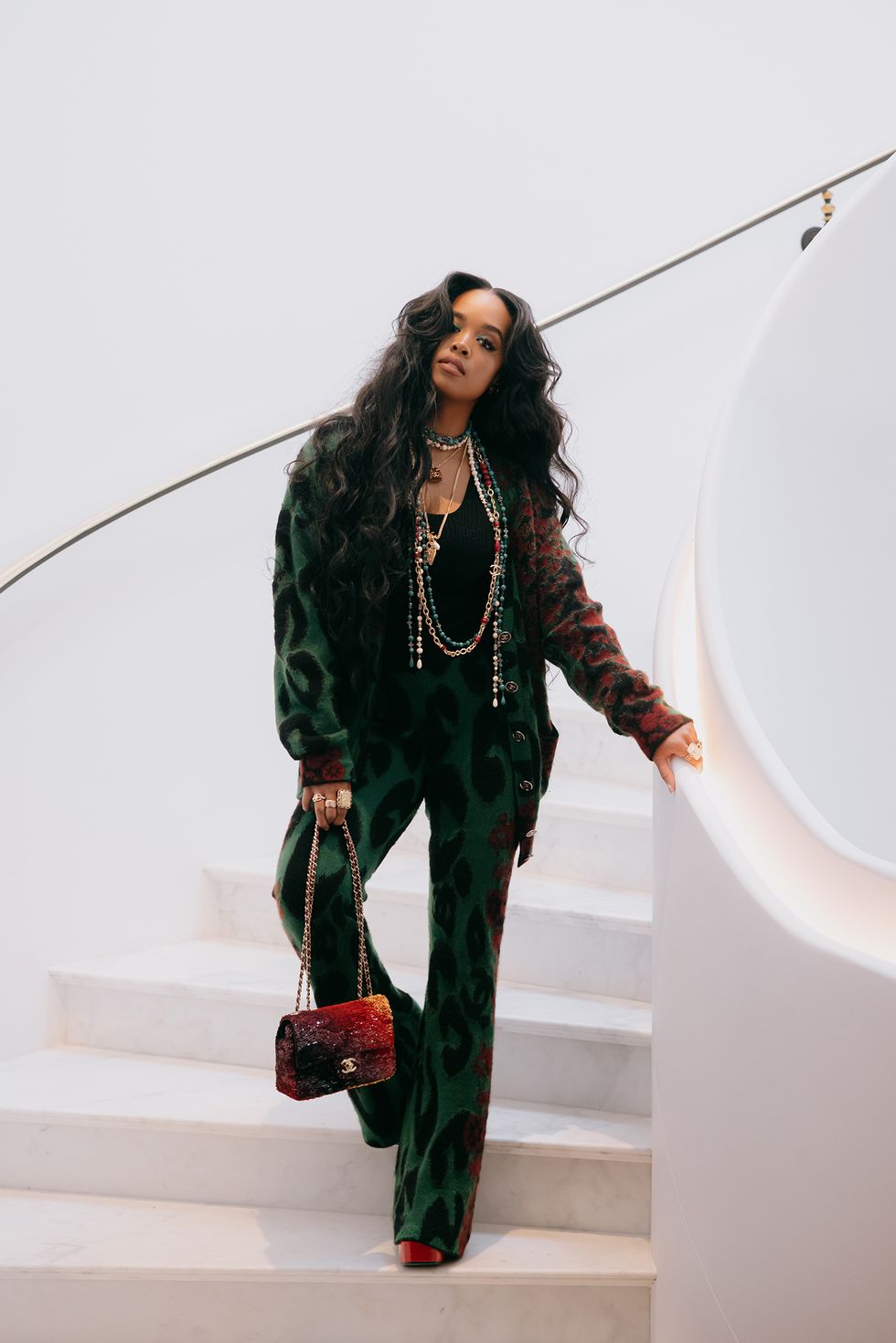 her walks down a staircase wearing chanel in a post about her at chanel fall 2023 paris fashion week