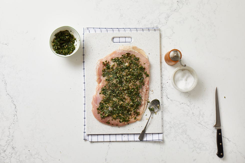 herb mixture in butterflied turkey breast