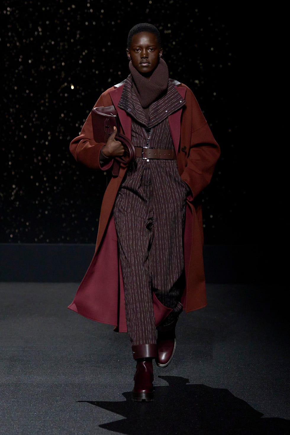 Fashion model showcasing contemporary outerwear and layered clothing