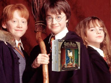 harry, ron y hermione con juego de mesa copa de las casas