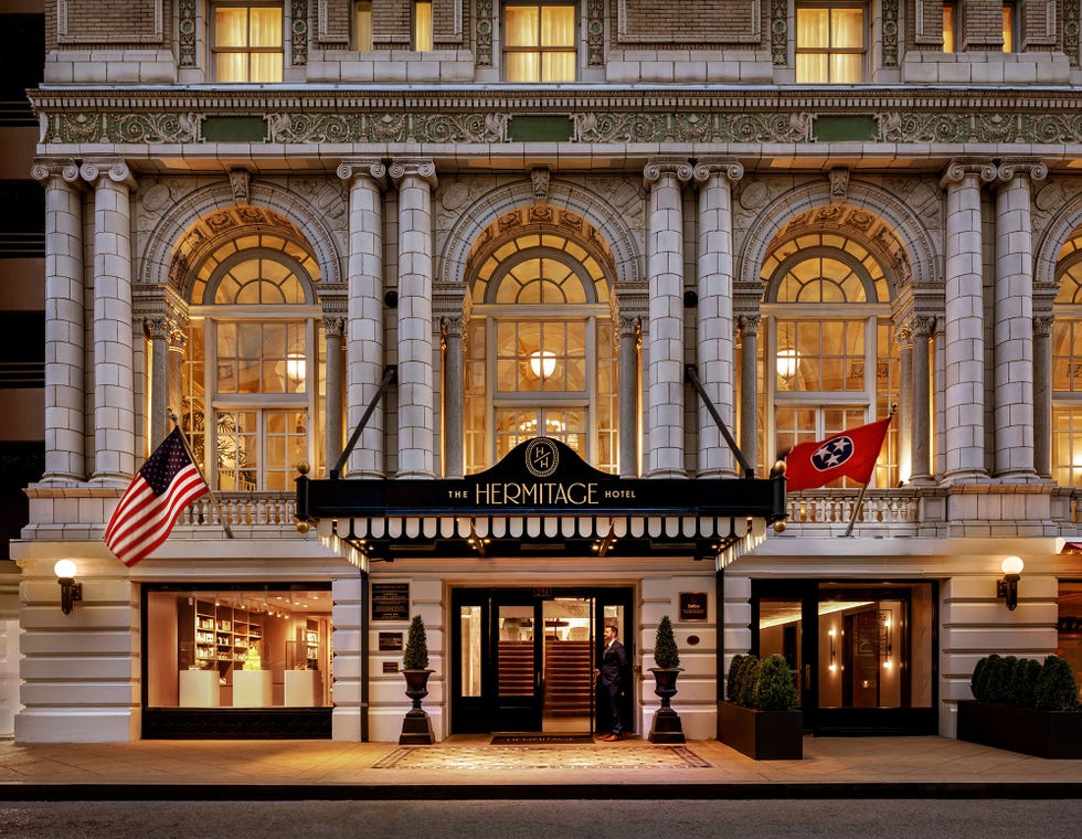 facade of the hermitage hotel featuring classical architecture and dual flags