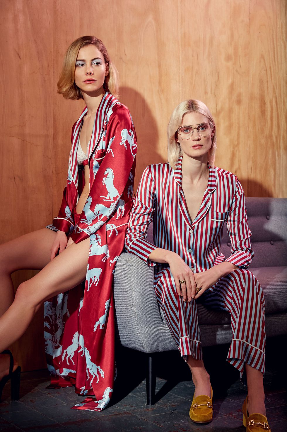 two women wearing red and blue pyjamas