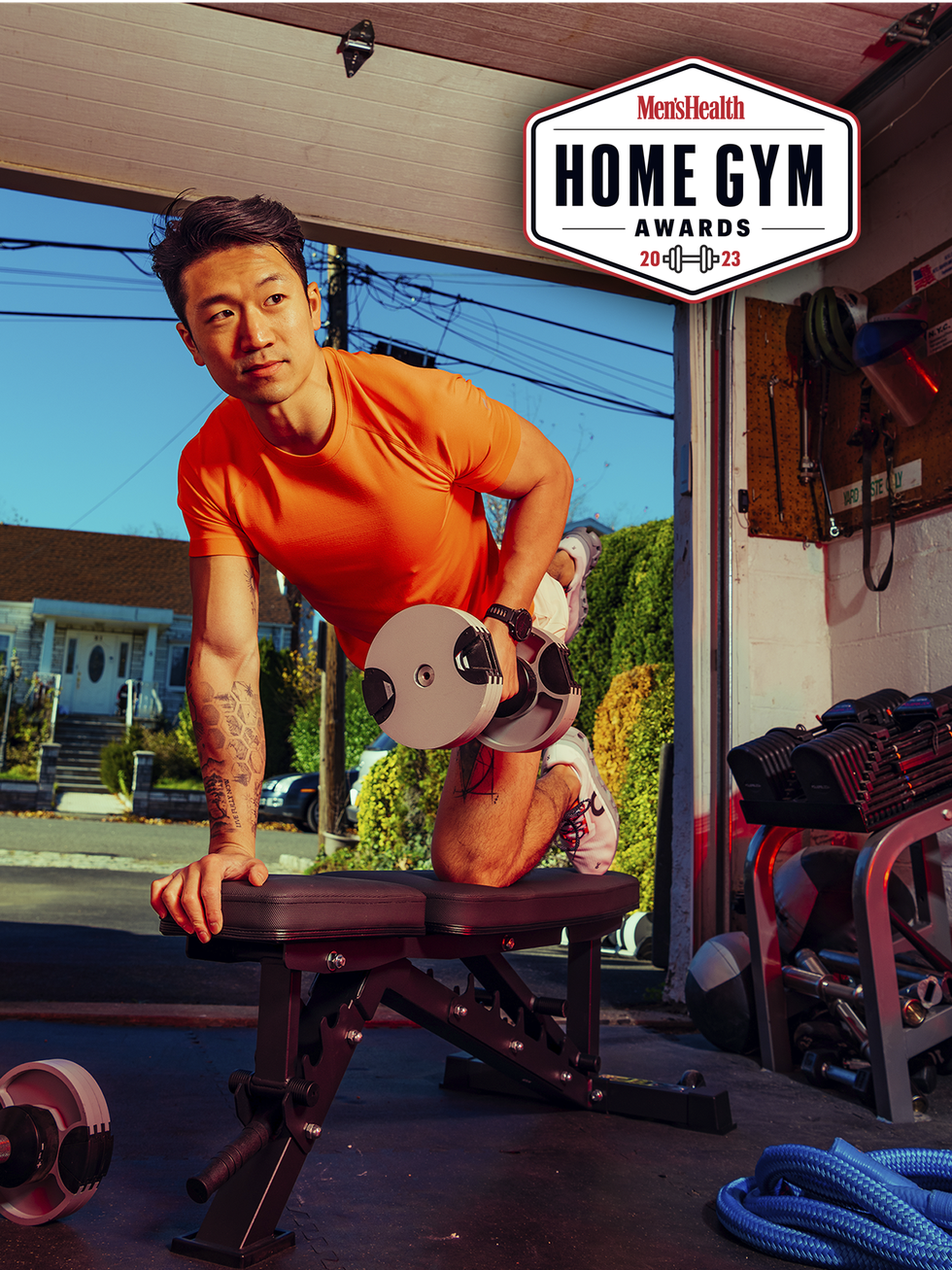 man lifting weight in home gym