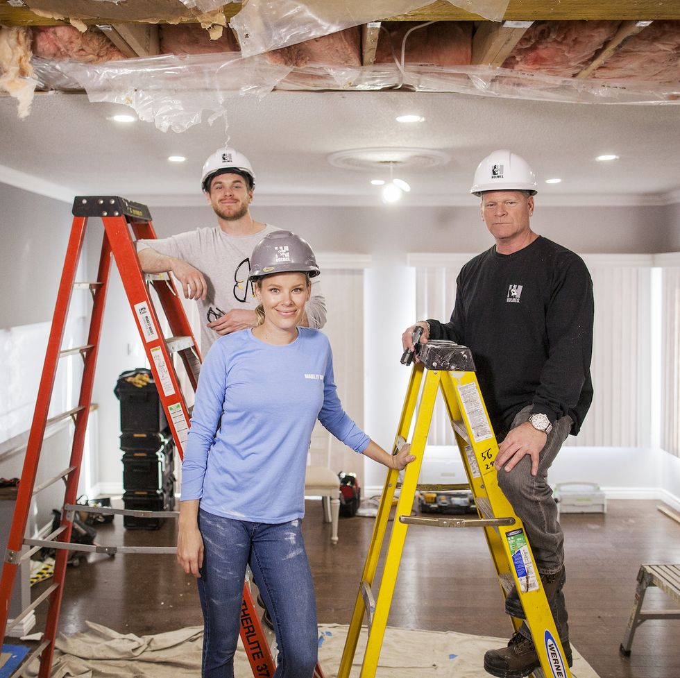 mike holmes r, sherry holmes c and mike holmes jr l pose for a photo druing a kitchen renovation as seen on holmes next generationtalent posed