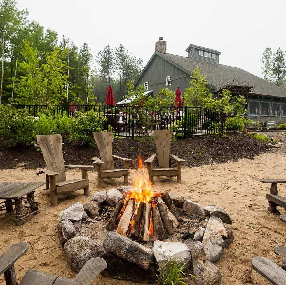 campfire at hidden pond in maine, good housekeeping's pick for best family vacation destinations