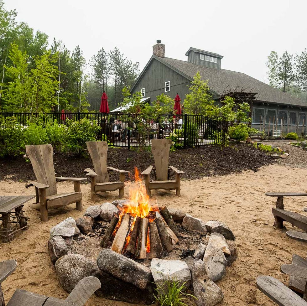 campfire at hidden pond in maine, good housekeeping's pick for best family vacation destinations