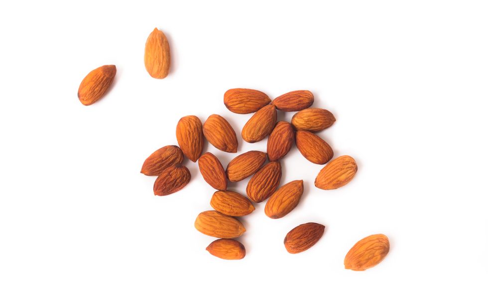 High Angle View Of Almonds On White Background