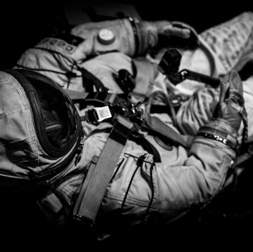 high angle view of astronaut against black background