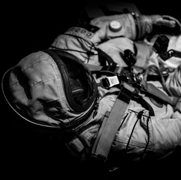 high angle view of astronaut against black background