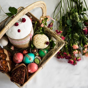 high angle view of easter basket with flowers on table