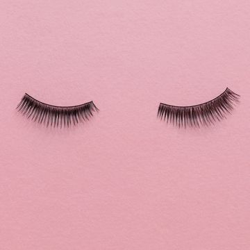 fake lashes on a pink background