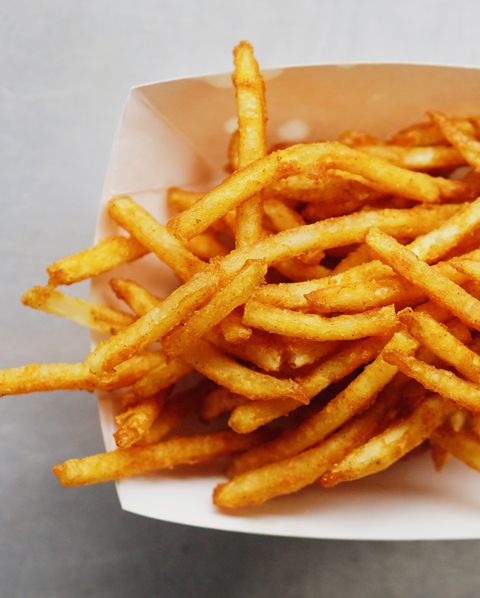 high angle view of french fries in box on table