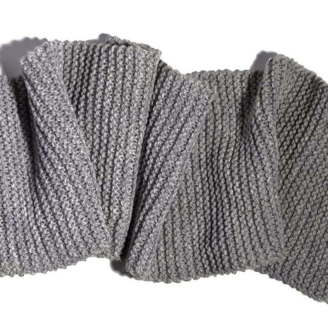 high angle view of gray woolen scarf on white background