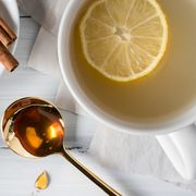 high angle view of honey with lemons on table