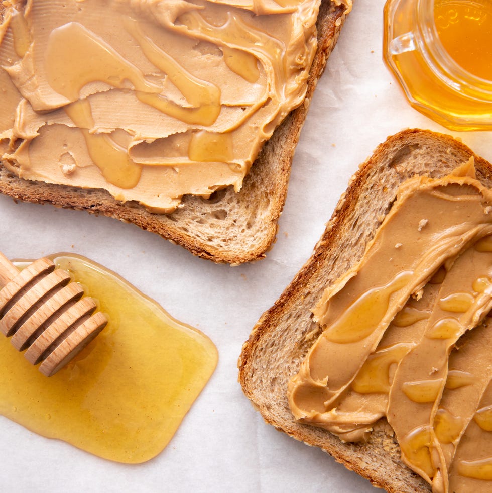 High angle view of honey with peanut butter on table high angle view of honey with peanut butter on table
