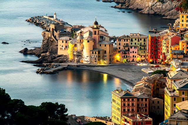 high angle view of illuminated buildings by sea,camogli,genoa,italy