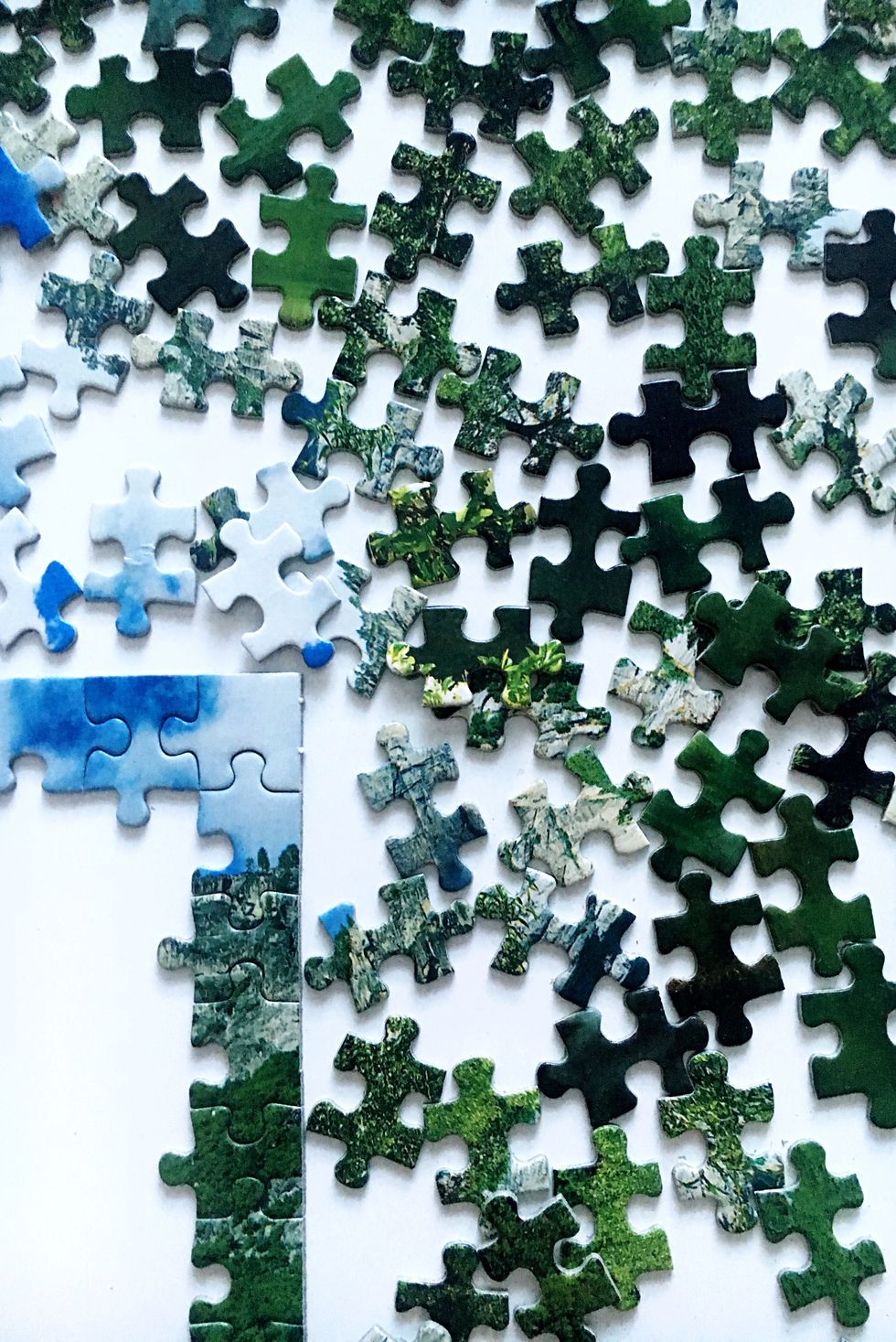 High Angle View Of Jigsaw Puzzle On Table