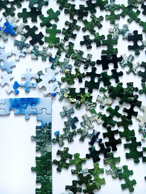 High Angle View Of Jigsaw Puzzle On Table