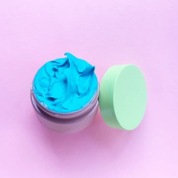High Angle View Of Moisturizer On Pink Background