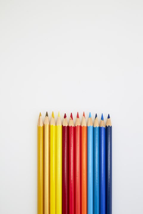 High Angle View Of Multi Colored Pencils Against White Background