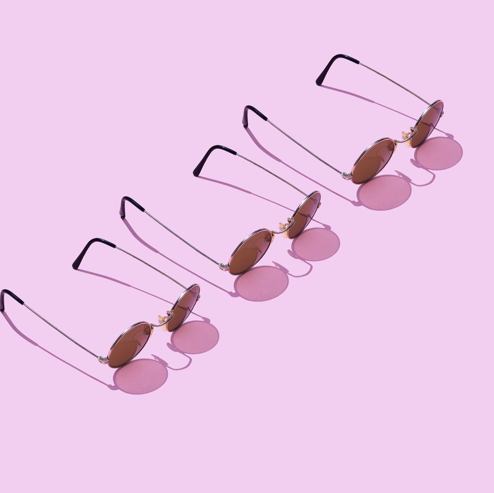 high angle view of sunglasses against pink background