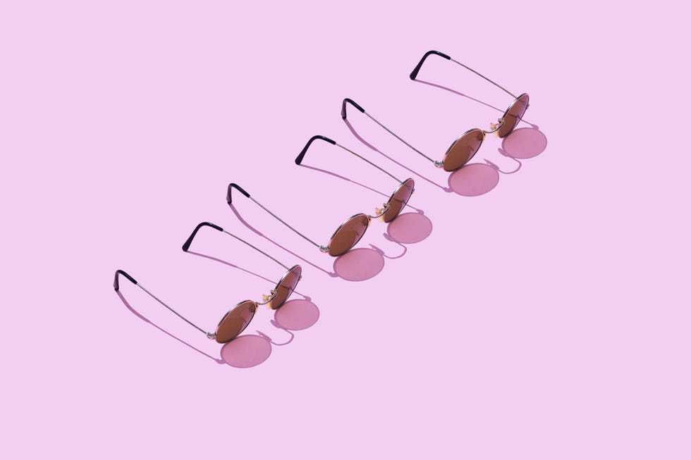 high angle view of sunglasses against pink background