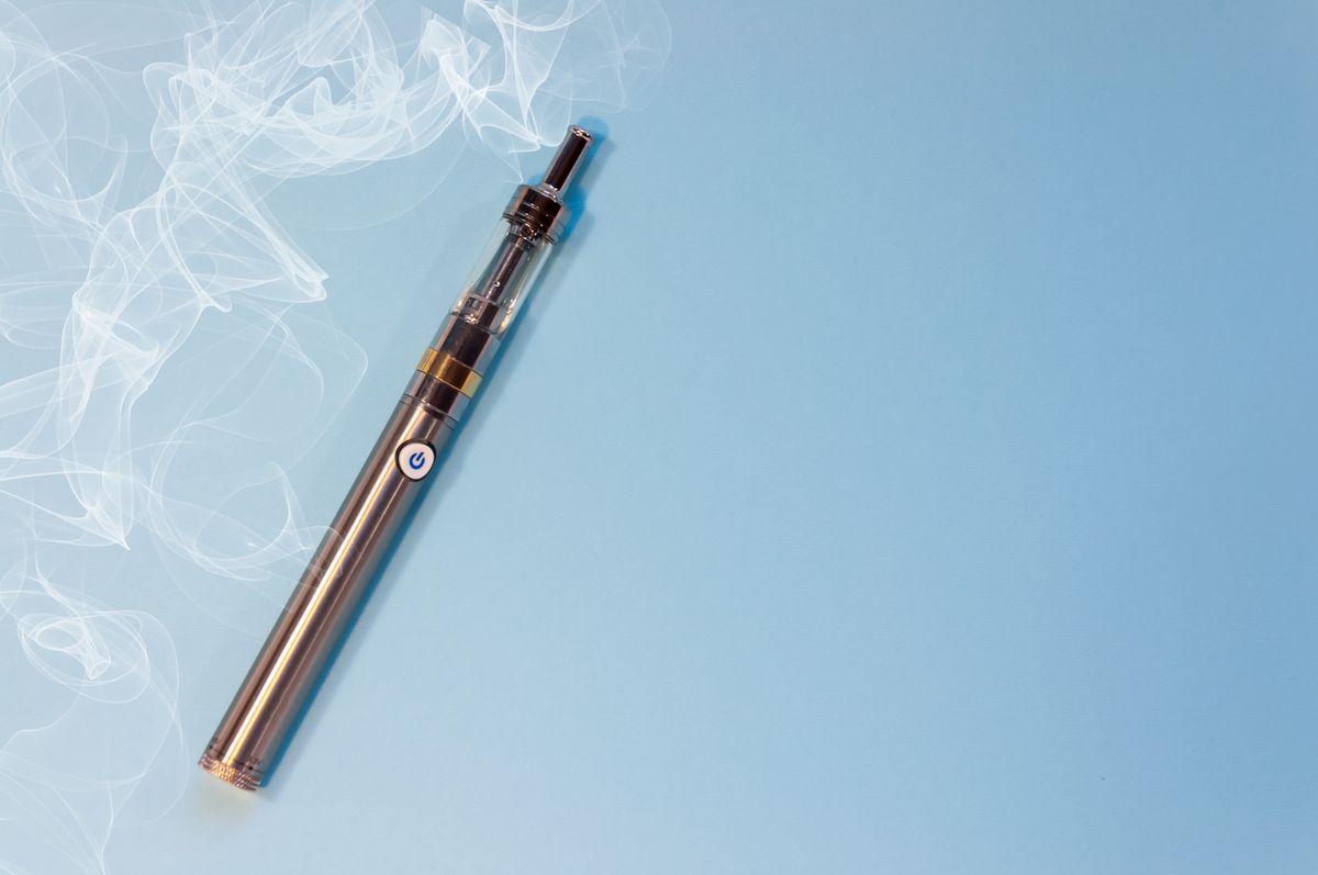 high angle view of vape on blue background