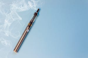 high angle view of vape on blue background