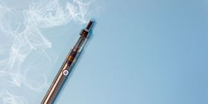 high angle view of vape on blue background