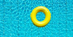 High Angle View Of Yellow Rubber Ring In The Pool