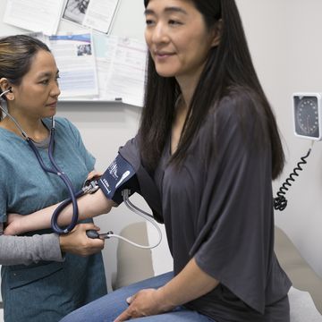 Woman getting her blood pressure read.