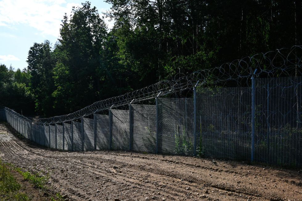 lithuanian guards patrol border with belarus