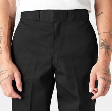 black trousers worn by a person with tattoos on their arms black trousers worn by a person with tattoos on their arms