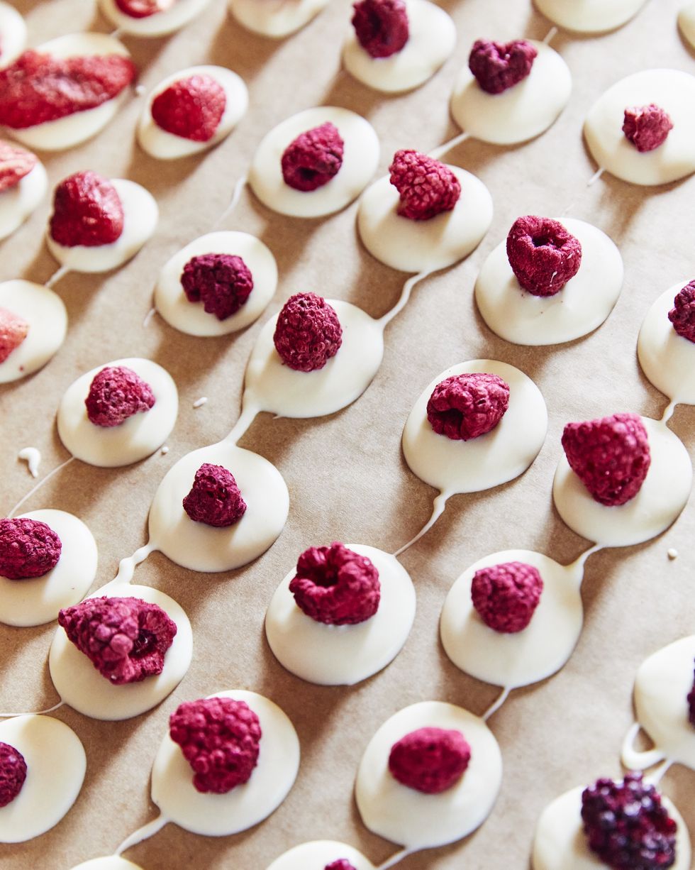 a tray of white chocolate and raspberry treats