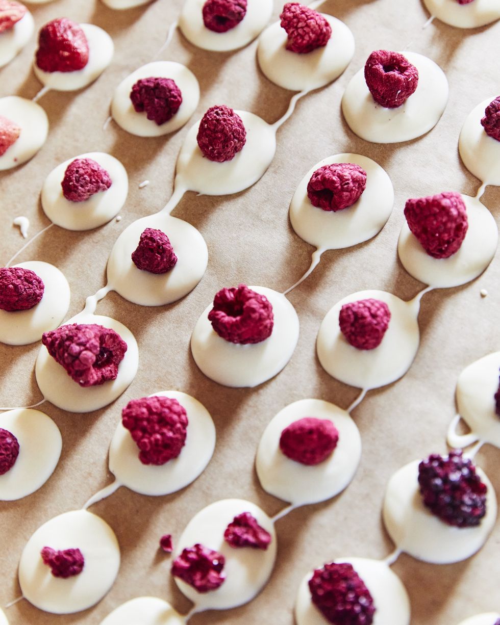 a tray of white chocolate and raspberry treats
