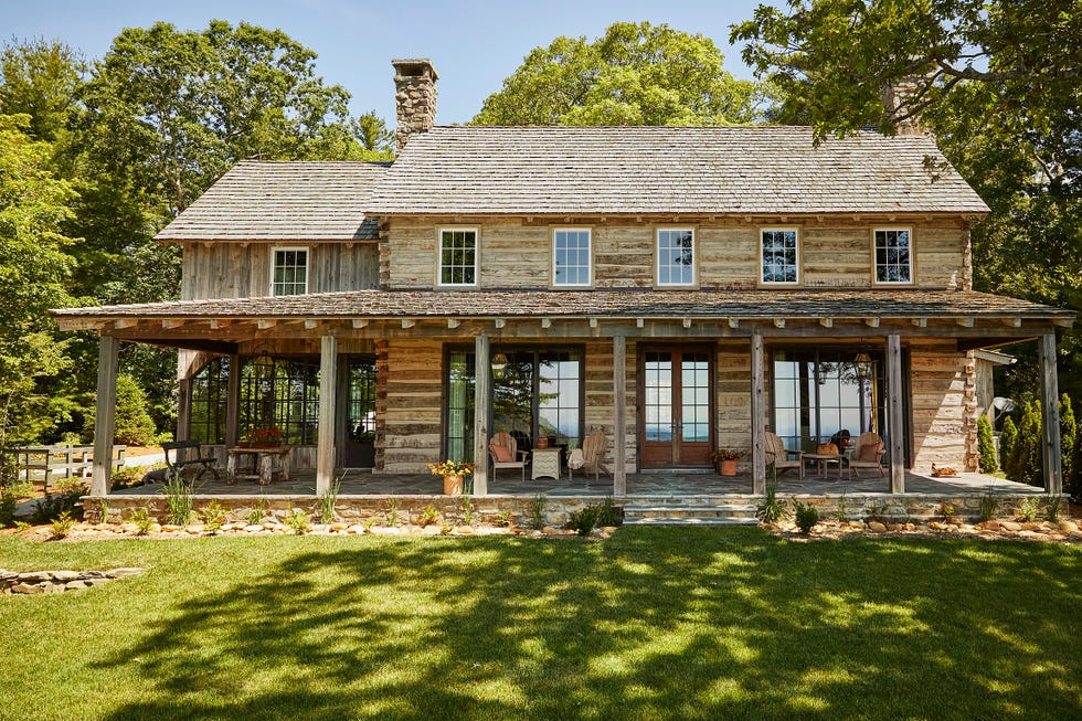 north carolina log cabin style mountain house exterior with porch