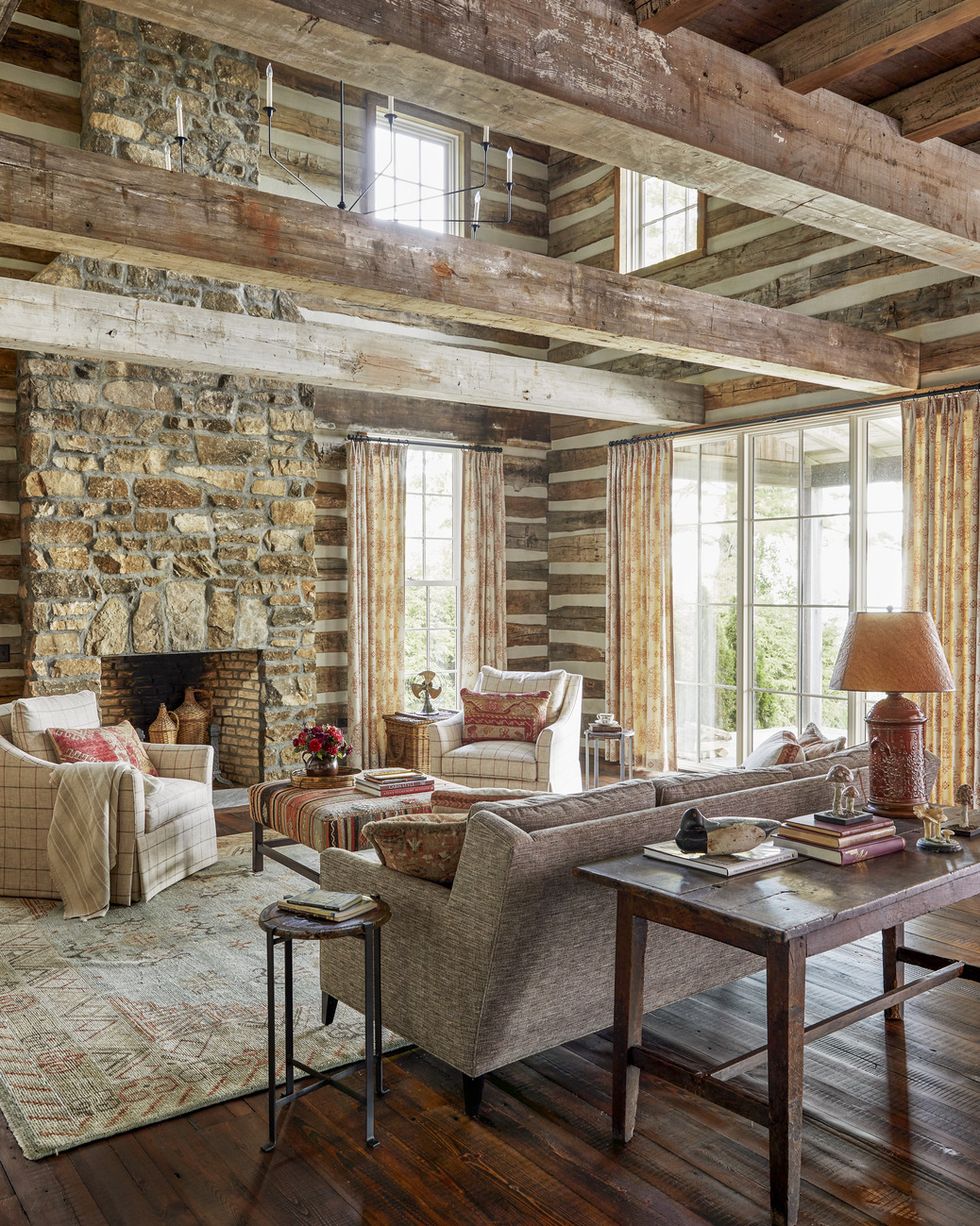 a living room with a log cabin wall and natural materials