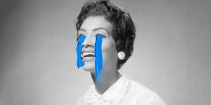 a black and white image of a woman crying painted on blue tears