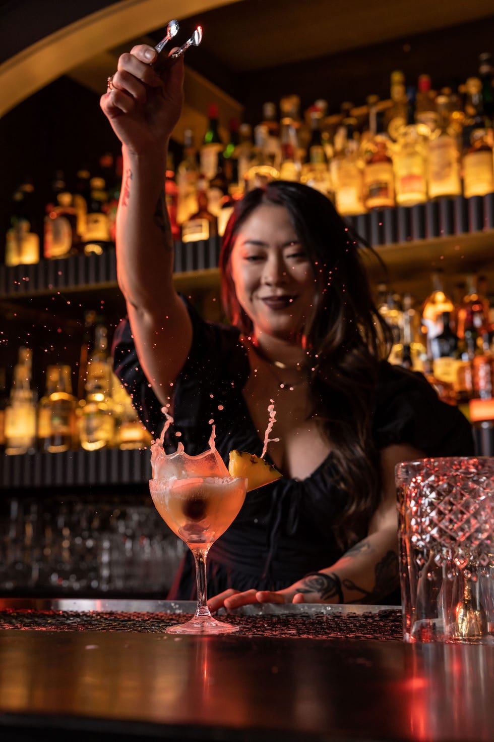 a person holding a bottle of wine