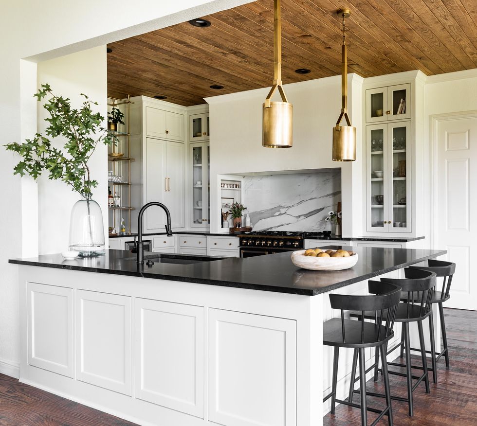 tradition kitchen with black, white, and wood palette