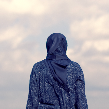 As a Muslim woman of colour, I’ve never felt more unsafe in Britain a woman wearing a hijab facing away from camera