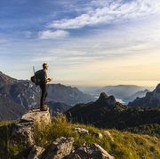 hiker alone looking at view from mountain top
