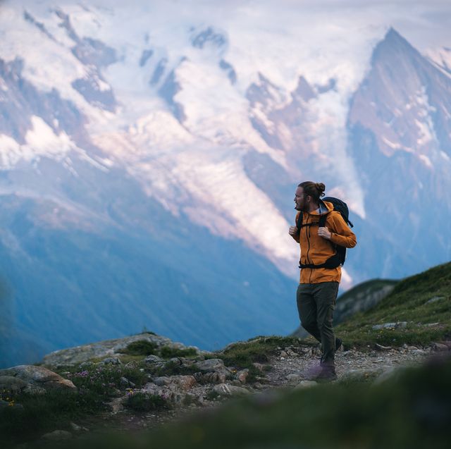 hiker explores mountain landscape